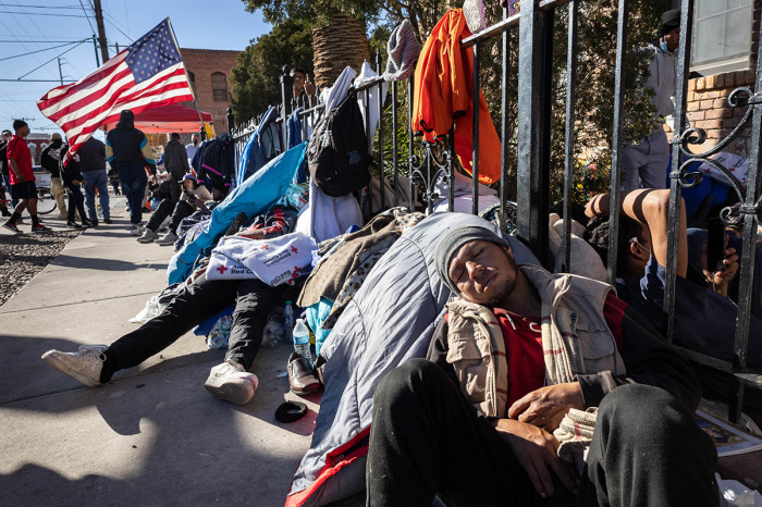 Immigrants who entered the U.S. illegally sleep on a sidewalk near a migrant shelter on January 06, 2023, in El Paso, Texas. President Joe Biden visited El Paso on Sunday for his first-ever visit to the border in his decades-long career in politcs. U.S. Border authorities took into custody some 2.5 million illegal migrants in 2022, the highest number on record. 