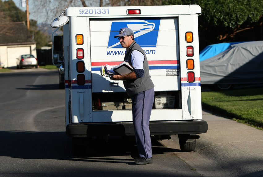 U.S. Postal Service letter carrier Dennis Stecz prepares to deliver mail on his route January 28, 2009, in San Lorenzo, California. 