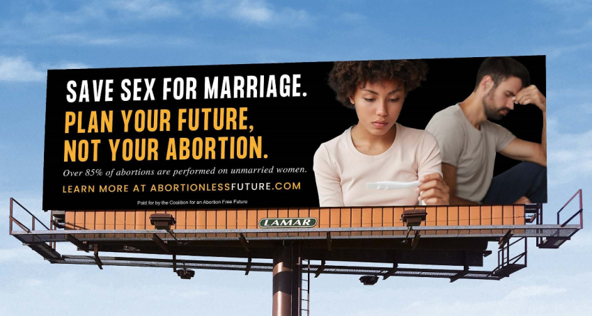 A billboard sponsored by the Life Legal Defense Foundation shows a woman looking at the results of a pregnancy test.