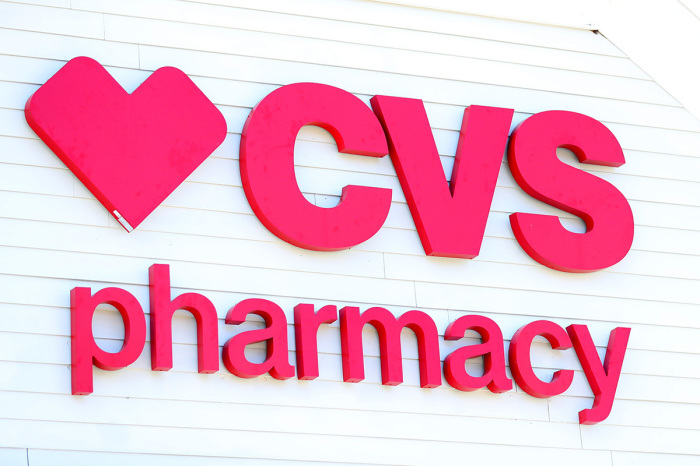 A sign on the side of the CVS Pharmacy on May 15, 2020, in Carver, Massachusetts. 