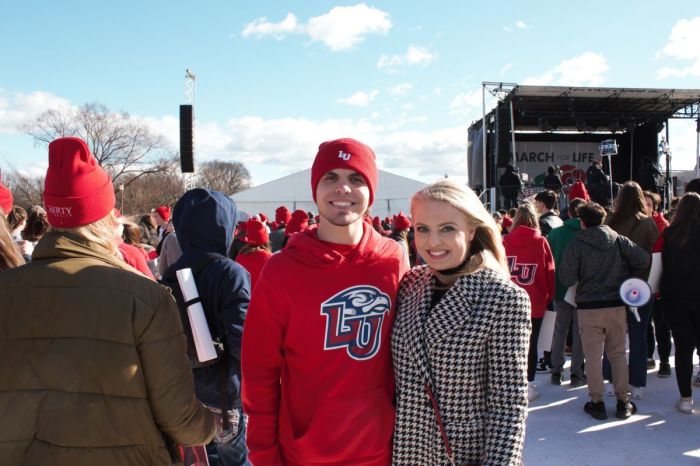 Liberty University students Jesse Hughes (L) and Emily Huseman (r) attend the March for Life in Washington, D.C., on Jan. 20, 2023.