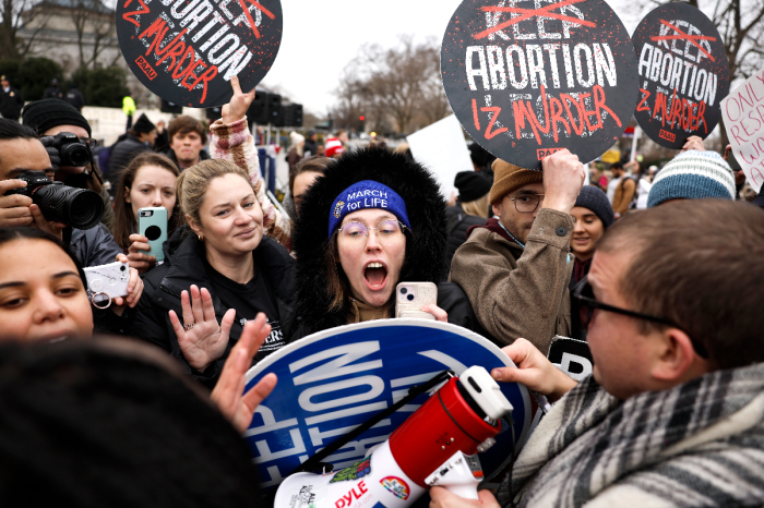 Participants of the annual National Women's March argue with anti-abortion activists in front of the U.S. Supreme Court Building on Jan. 22, 2023, in Washington, D.C., the 50-year anniversary of the court's ruling in Roe v. Wade.
