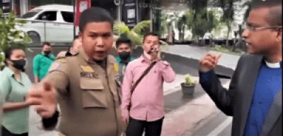 A church leader speaks with a public order official in Medan, North Sumatra, Indonesia, on Jan. 8, 2023. (Morning Star News screenshot from YouTube) 