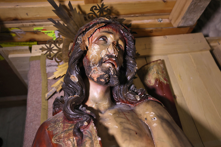 A picture shows a wooden statue of Jesus that was pulled down and damaged in the Church of the Condemnation, where Christians believe Jesus was flogged and sentenced to death, in Jerusalem's Old City on February 2, 2023. - Israeli police said officers arrested an American man today over vandalizing the church along a major pilgrimage route in Jerusalem's Old City. 
