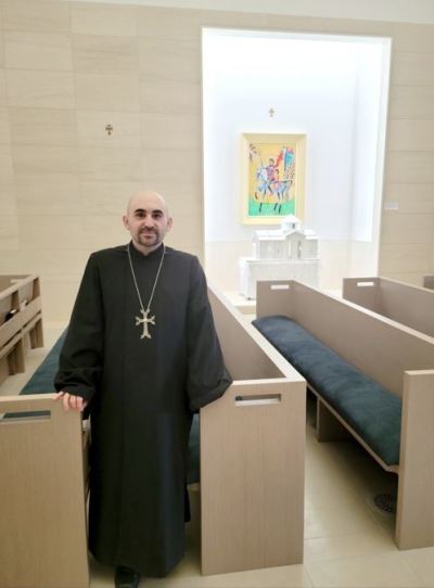 Fr. Ghevond Ajamian inside the sanctuary at Saint Sarkis.