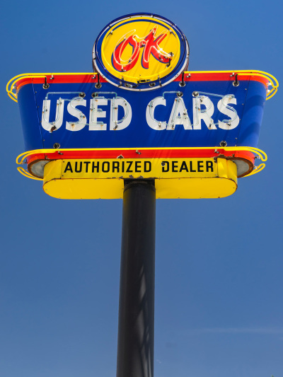 This antique sign is used by a classic car restorer to advertise their business on Route 66 in Kingman, Arizona, on May 22, 2019
