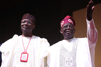 Nigeria President-elect Bola Tinubu (R) and Chairman of the Independent National Election Commission (INEC) Yakubu Mahmood (L) look on during the presentation of the certificate of return to the President-elect by the INEC in Abuja on March 1, 2023. 