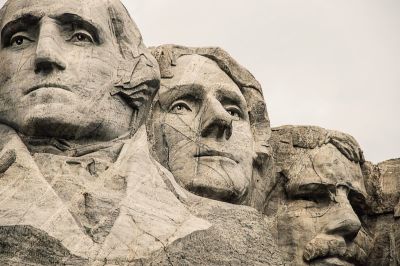 Mount Rushmore National Memorial is in South Dakota. The granite faces depict U.S. presidents George Washington, Thomas Jefferson, Theodore Roosevelt and Abraham Lincoln.