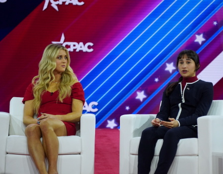 Chloe Cole (R) joins NCAA All-American swimmer Riley Gaines (L) on stage at the Conservative Political Action Conference at the Gaylord National Resort and Convention Center in National Harbor, Maryland, on March 3, 2023.