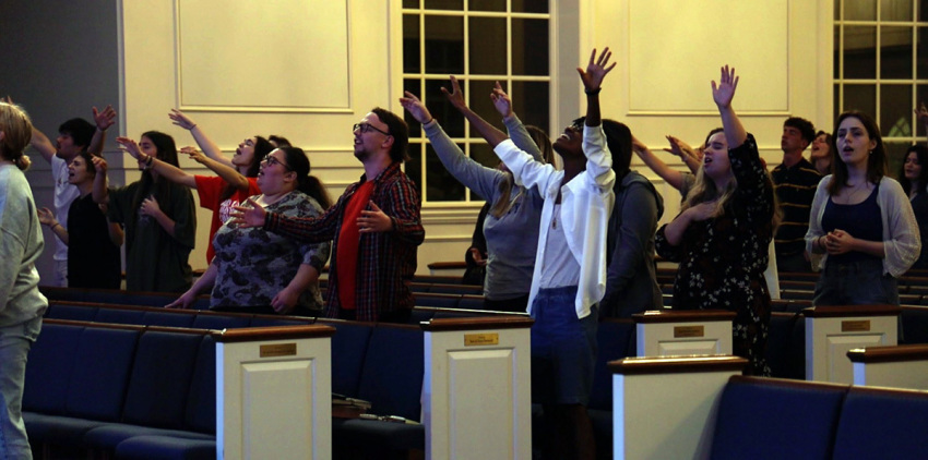 Students taking part in revival worship at the campus of Regent University of Virginia Beach, Virginia, during spring break, 2023.