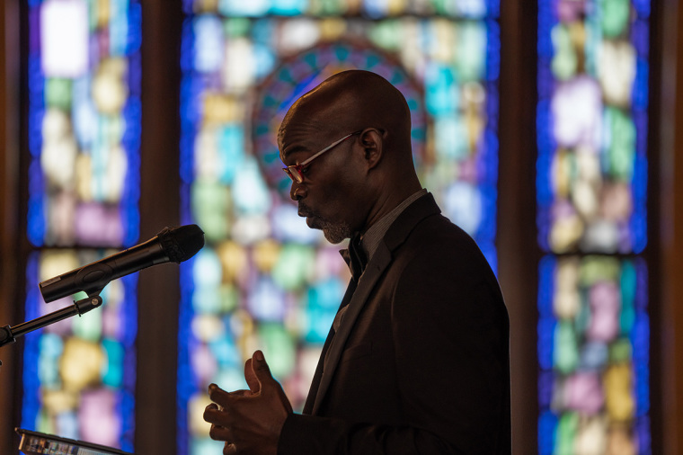 Black pastor, congregation, sermon, stained glass 