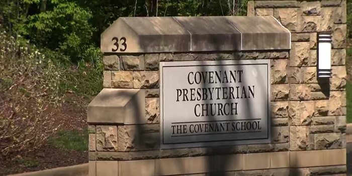 A sign sits outside Covenant Presbyterian Church - The Covenant School in Nashville, Tennessee. 