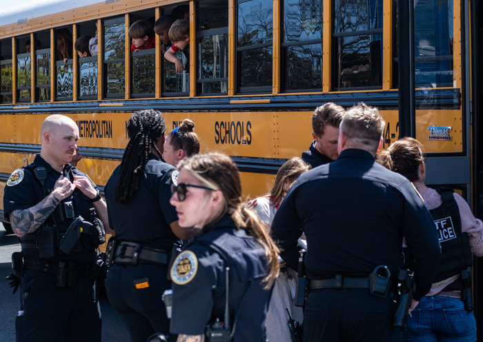 School buses with children arrive at Woodmont Baptist Church to be reunited with their families after a mass shooting at The Covenant School on March 27, 2023, in Nashville, Tennessee. According to initial reports, three students and three adults were killed by the shooter, a 28-year-old woman. The shooter was killed by police responding to the scene. 