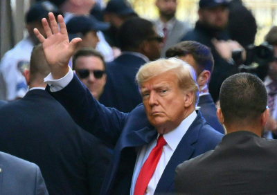 Former U.S. President Donald Trump arrives ahead of his arraignment at the Manhattan Criminal Court in New York on April 4, 2023. - Trump arrived for a historic court appearance in New York on Tuesday, facing criminal charges that threaten to upend the 2024 White House race. 