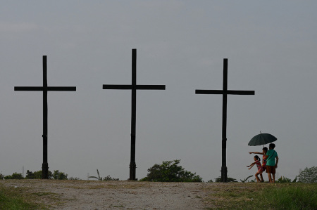 People visit the site where the re-enactment of the crucifixion of Jesus Christ will take place during Holy Week celebrations in San Fernando, Pampanga province on April 4, 2023.