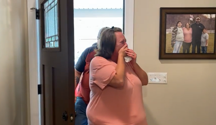 Jamie Smith is moved to tears as she walks through the doors of her new home in Letcher County, Kentucky, for the first time on April 6, 2023.