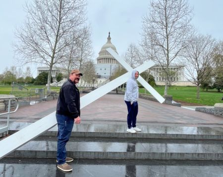Participants in a Good Friday service at the United States Capitol Building, spearheaded by the Christian Defense Coalition, carry a 15-foot cross on Capitol grounds, Apr. 7, 2023.
