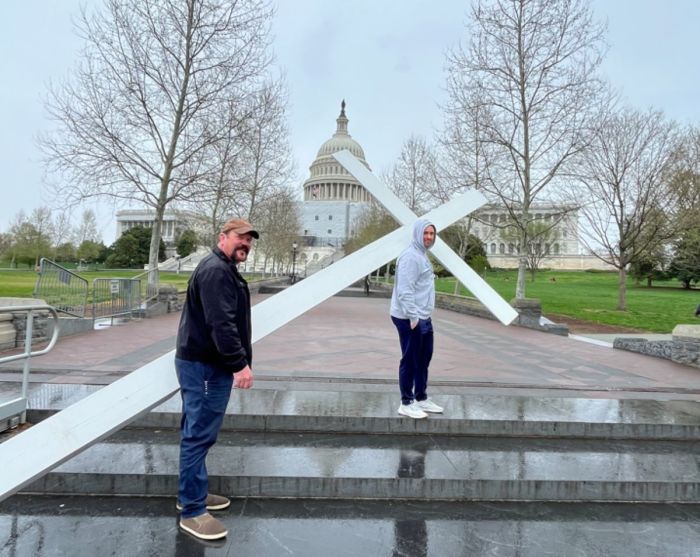 Participants in a Good Friday service at the United States Capitol Building, spearheaded by the Christian Defense Coalition, carry a 15-foot cross on Capitol grounds, Apr. 7, 2023. 