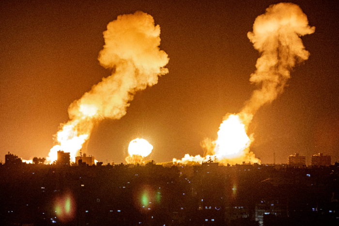 This picture, taken early on April 7, 2023, shows explosions in Khan Yunis in the southern Gaza Strip during Israeli air strikes on the Palestinian enclave. 