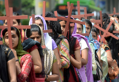 Indian Christian devotees carry crosses as they take part in a procession in remembrance of the crucifixion of Jesus Christ to mark Good Friday in New Delhi on April 18, 2014. Christians, for whom Easter marks the crucifixion and resurrection of Christ, account for 2.3 percent of India's billion-plus Hindu-majority population. 