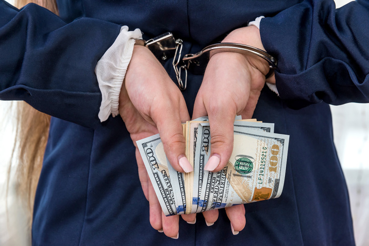 Woman, money, arrest