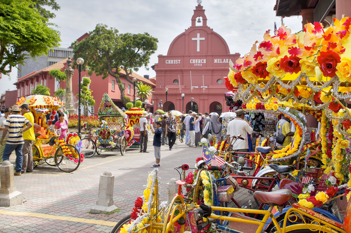 Christ Church in Melaka Malaysia on Jan. 14, 2012. The area is a popular historic tourist attraction in Melaka Malaysia with flower decorated tricycles for hire.