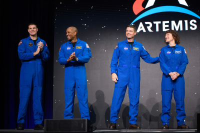 (L-R) Astronauts Jeremy Hansen, Victor Glover, Reid Wiseman and Christina Hammock Koch stand onstage after being selected for the Artemis II mission around the moon during a news conference held by NASA and CSA at Ellington Airport in Houston, Texas, on April 3, 2023. Traveling aboard NASA's Orion spacecraft during Artemis II, the mission is the first crewed flight test on the agency's path to establishing a long-term scientific and human presence on the lunar surface.