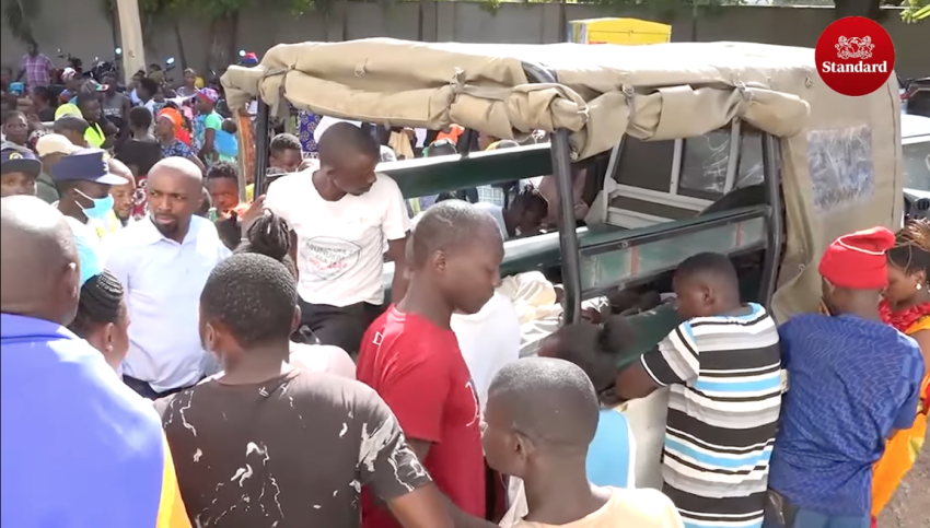 Onlookers look at dead bodies discovered in Shakahola forest near Malindi area in southeastern Kenya in April 2023. 