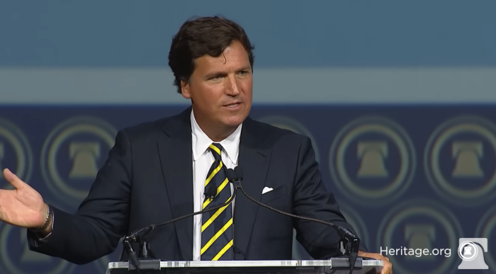 Tucker Carlson delivers a speech at the Heritage Foundation on April 20, 2023.