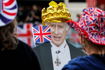 A cardboard picturing Britain's King Charles III with Union Jack is pictured along the procession route on The Mall, near to Buckingham Palace in central London, on May 5, 2023, ahead of the coronation weekend. - The country prepares for the coronation of Britain's King Charles III and his wife Britain's Camilla, Queen Consort on May 6, 2023.