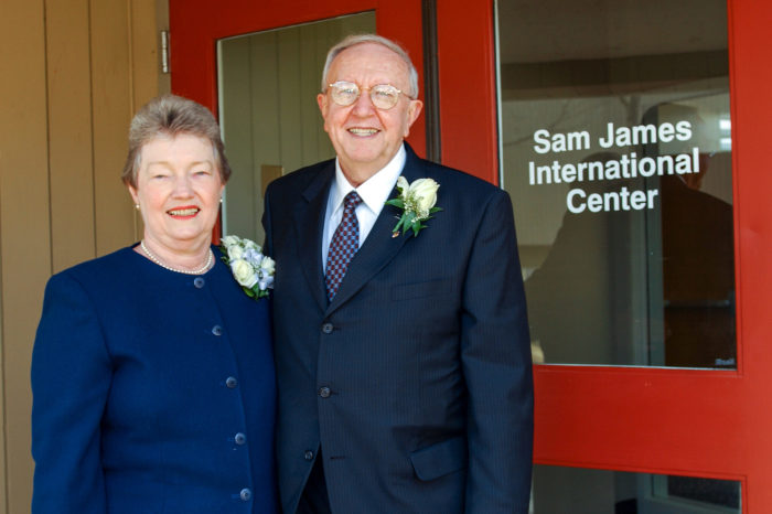 Sam and Rachel James pose with the building named for Sam at dedication ceremony in 2002.