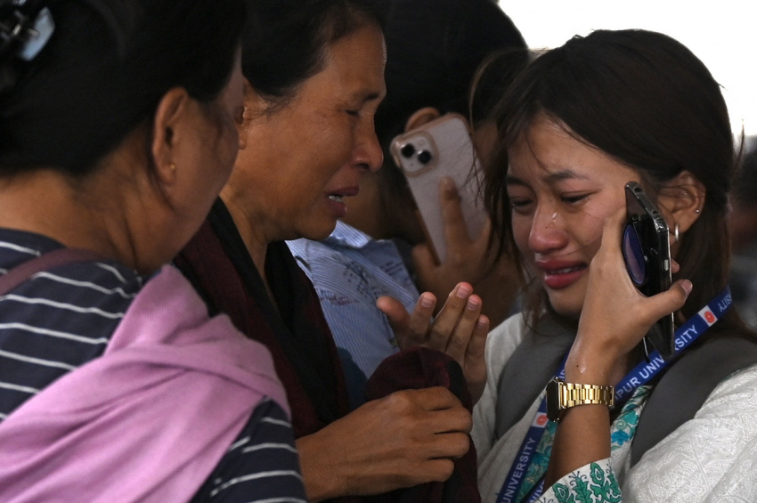 A woman cries as she waits at the airport to flee ethnic violence that has hit the region, in Imphal, northeastern Indian state of Manipur on May 7, 2023. Some 23,000 people have fled ethnic violence in northeast India that has reportedly killed at least 54, the army said On May 7, 2023, although there was no new "major violence" overnight.