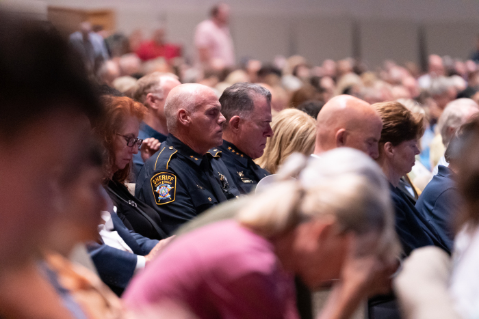 Law enforcement officers pray during Sunday's vigil at Cottonwood Creek Church in Allen, Texas, May 7, 2023. 