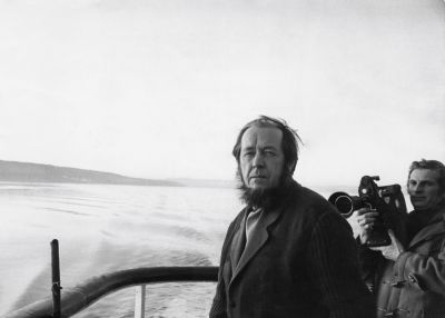 Exiled Russian author Aleksandr Solzhenitsyn (1918 - 2008, left) travels to Oslo in Norway by boat, 25th February 1974.
