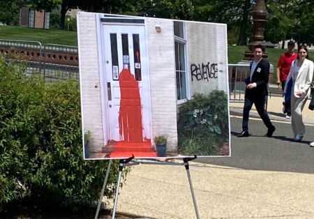 A poster displayed at a press conference following a U.S. House Judiciary Committee hearing about the Freedom of Access to Clinic Entrances (FACE) Act documents pro-abortion vandalism at Capitol Hill Pregnancy Center in Washington, D.C., May 16, 2023.