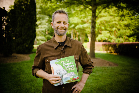 Actor and Christian book author Kirk Cameron seen posing with his new children's book, 'Pride Comes Before the Fall.'