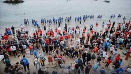 Thousands of people attend a baptism event sponsored by several churches at Pirates Cove, California, on Pentecost Sunday, May 28, 2023.