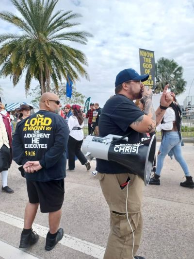 Street preacher Rich Penkoski (right) speaks at a protest in Tampa, Florida. 
