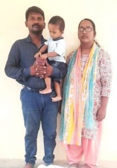 Pastor R. Kirubendran, wife Manju Tiruvendram and 18-month-old daughter post for a photo. 