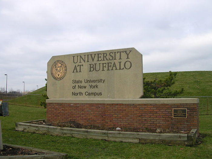 A sign sits at the entrance of the State University of New York at Buffalo campus. https://commons.wikimedia.org/wiki/File:SUNY_Buffalo_entrance_sign.JPG