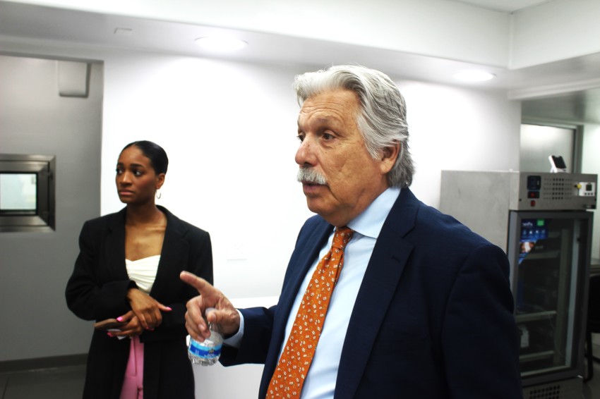 Dr. Francisco Contreras (foreground) inside space at the Oasis of Hope Hospital in Tijuana, Mexico, where a lab will be established in the next three months to produce therapeutic vaccines to treat a variety of cancers. Media specialist Morgann Delaney appears with him.