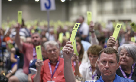 Messengers hold up ballot cards as they vote during the Southern Baptist Convention's Annual Meeting in New Orleans, Louisiana, held June 11-14, 2023.