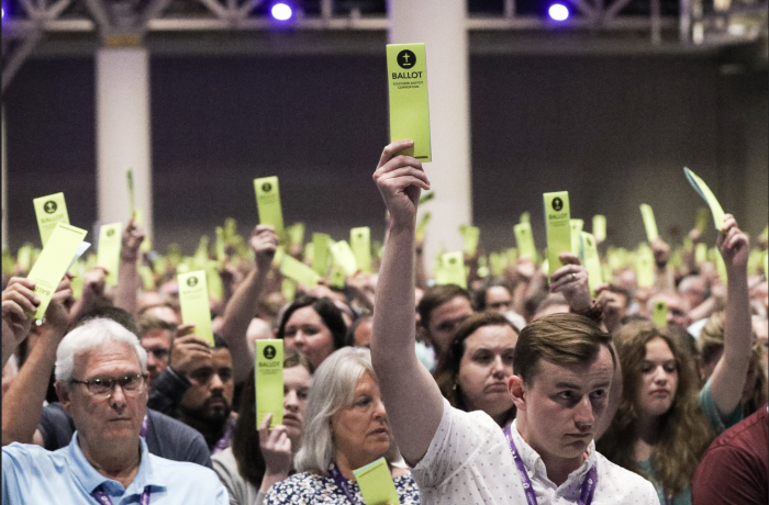 Messengers hold up their ballots at the Southern Baptist Convention Annual Meeting in New Orleans, Louisiana, on June 14, 2023. 