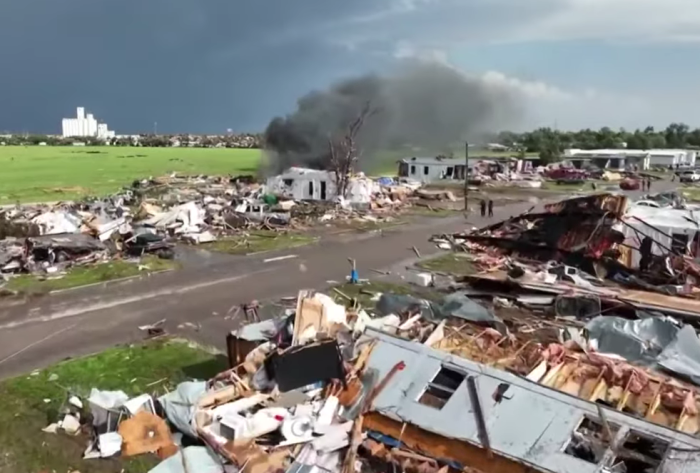Smoke rises in the aftermath of a tornado that struck Perryton, Texas, in June 15, 2023. 