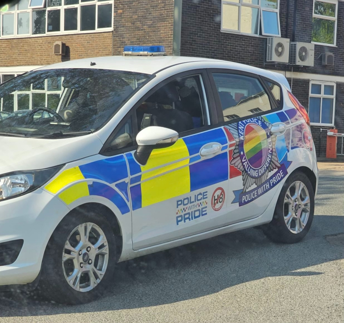 A British police cruiser decorated to show solidarity with LGBT pride. 
