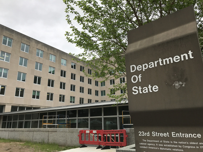 An entrance sign sits outside the U.S. Department of State headquarters in Washington, D.C.