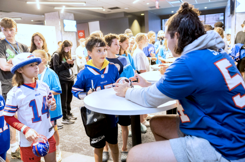 Children and NFL athletes participate at the Fields of Faith event held at Highmark Stadium in Orchard Park, New York, on June 13, 2023.