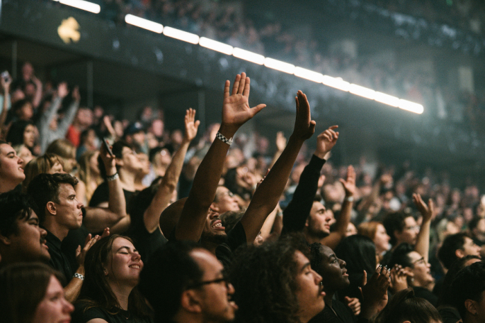 Attendees worship at SoCal Harvest on June 1, 2023, at the Honda Center in Anaheim, California. 