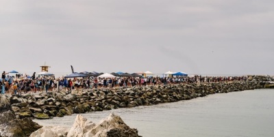 Thousands attend a mass baptism event at Pirates Cove Beach, California, on Saturday, July 8, 2023. Known as the Jesus Revolution Baptism at Pirate’s Cove and overseen by Harvest Christian Fellowship Pastor Greg Laurie, the event reportedly saw around 4,500 people baptized. 