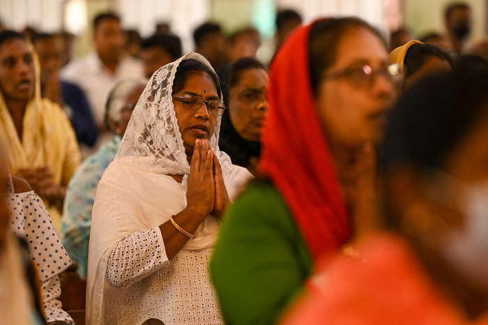 Christian devotees pray during Easter Sunday at a church in Chennai on April 9, 2023. 